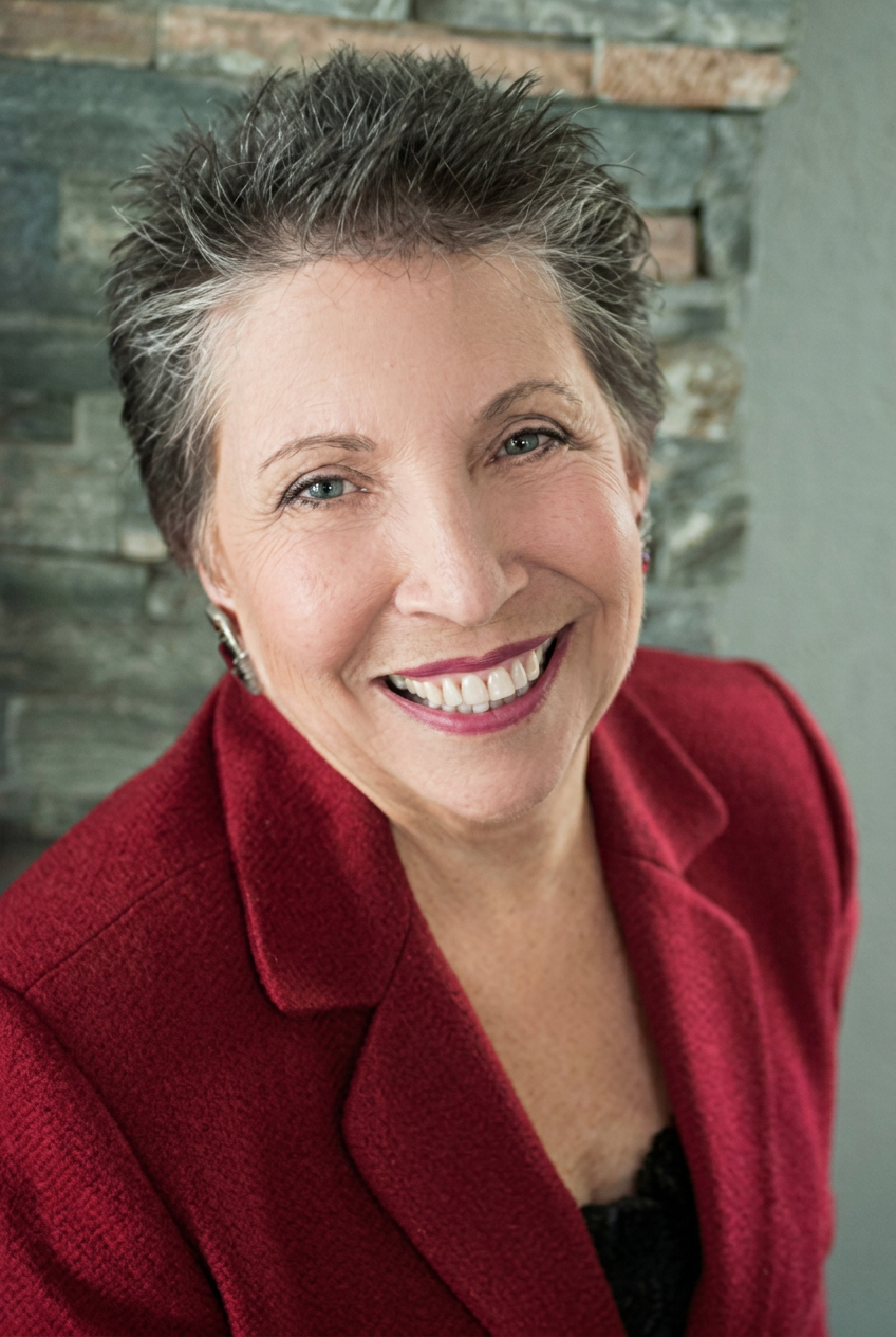 Kathleen Sims seated in her warmly lit Walnut Creek office